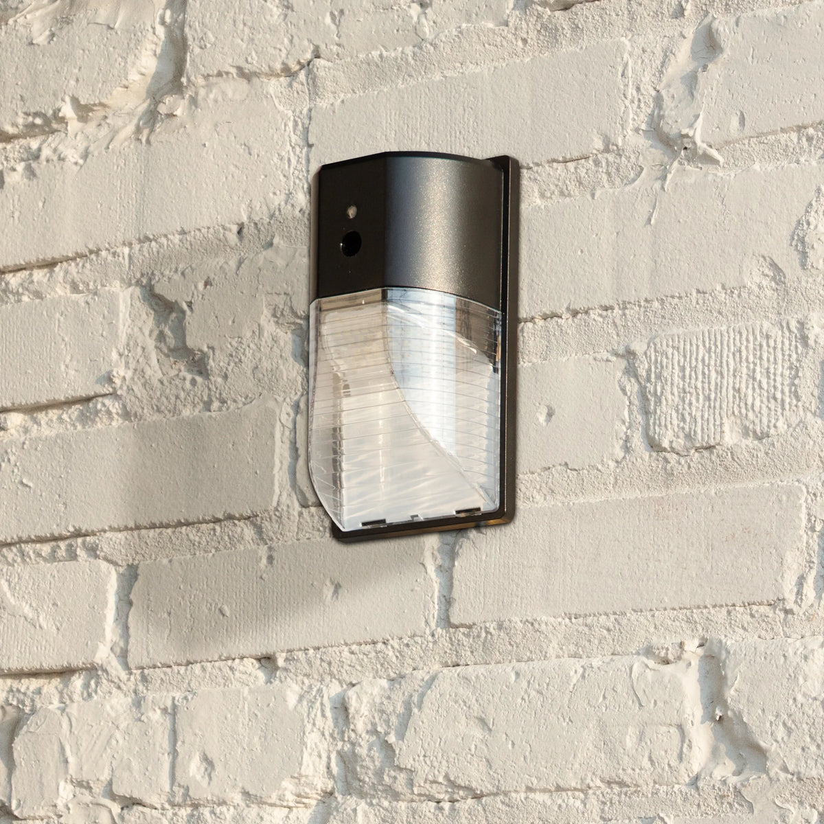 Direct Wire Pak Light with Clear Lens Cover, Dusk to Dawn, Black, 2000 Lumens, 120V M885